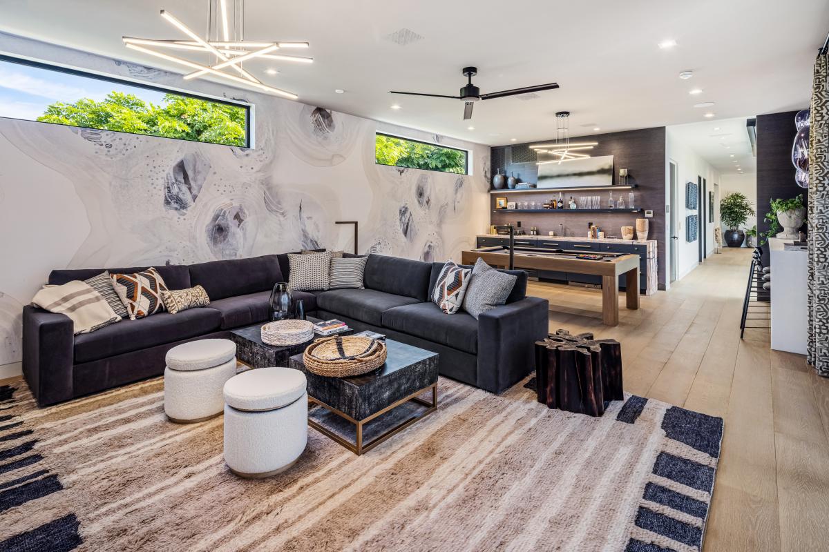 Gather for games, casual evenings, or movie nights in this cozy entertainment space with sectional seating.