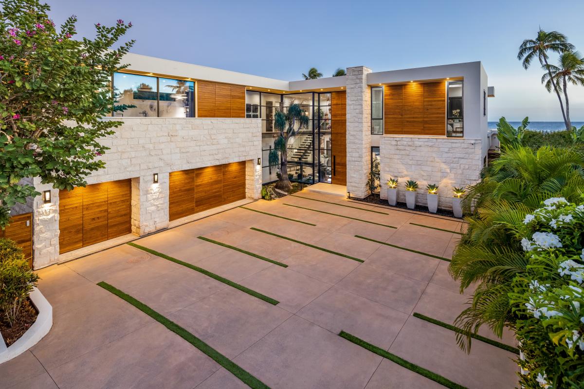Arrive in style through a private, gated entry with clean lines and contemporary landscaping.