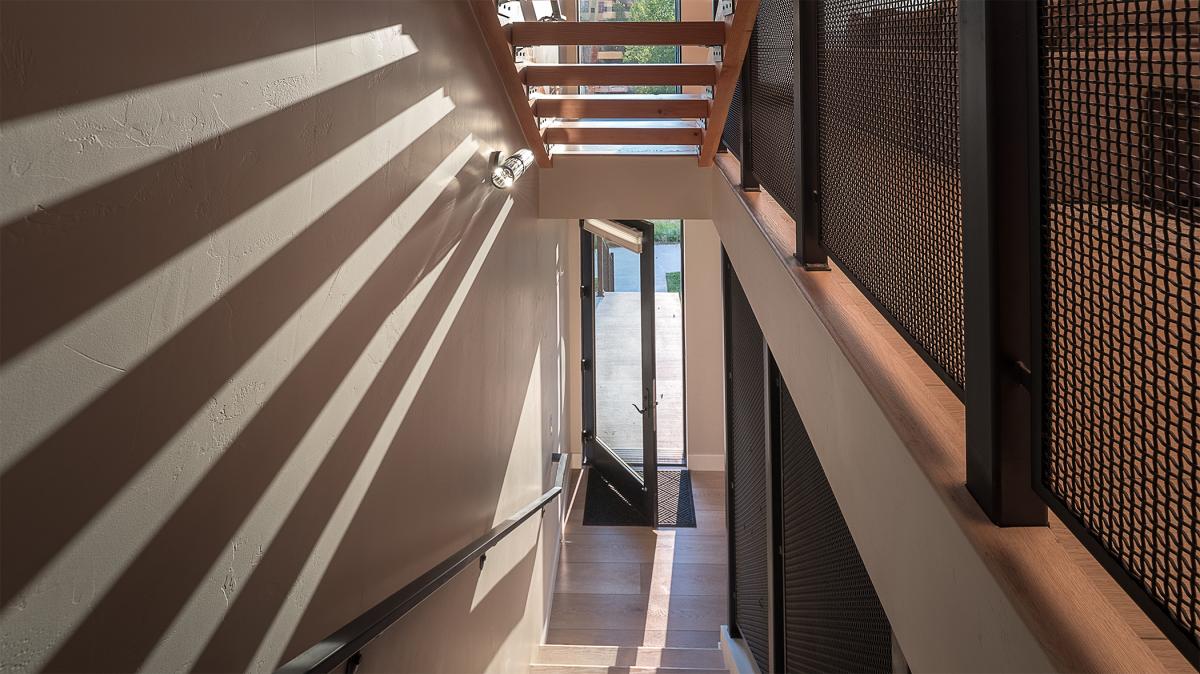 View down the stairway to the street-level entry