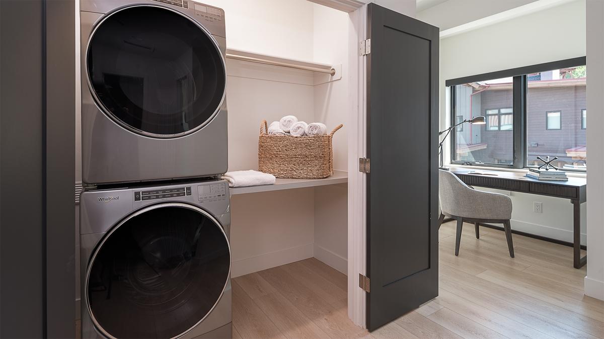 Laundry Room, Upper Level - Stacking washer and dryer