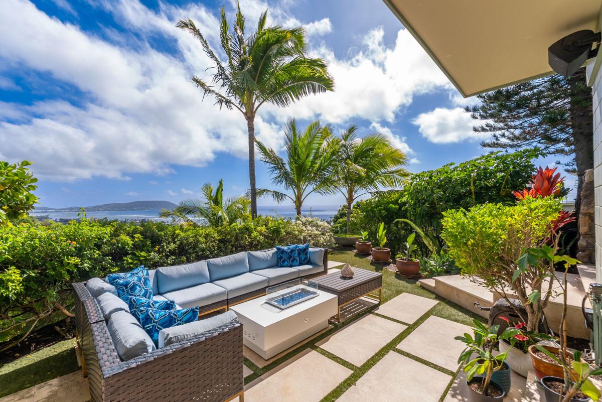 Ocean-view lounge area with a fire table—perfect for sunsets and evening gatherings.