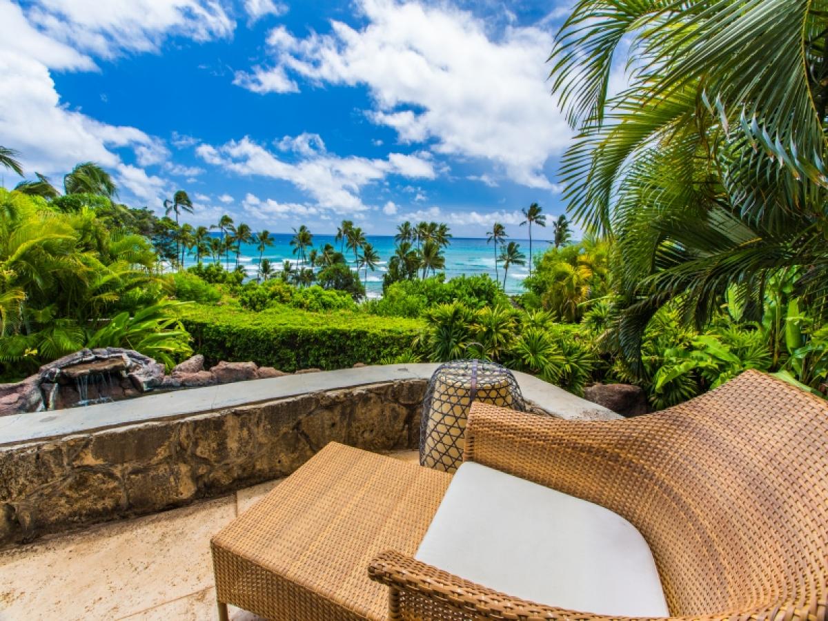Comfortable outdoor seating with elevated ocean views and cooling trade winds.