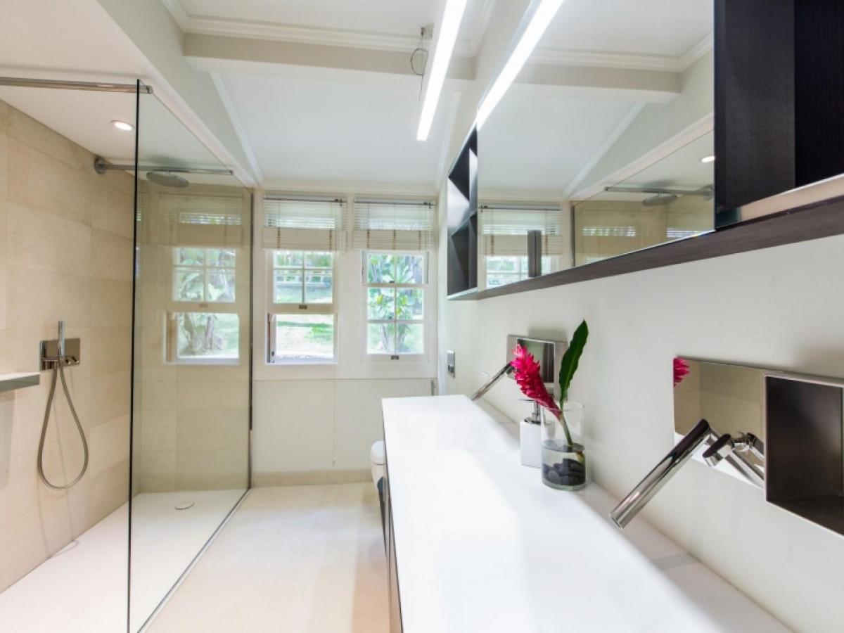 Refined primary bath featuring dual vanity and walk-in shower.