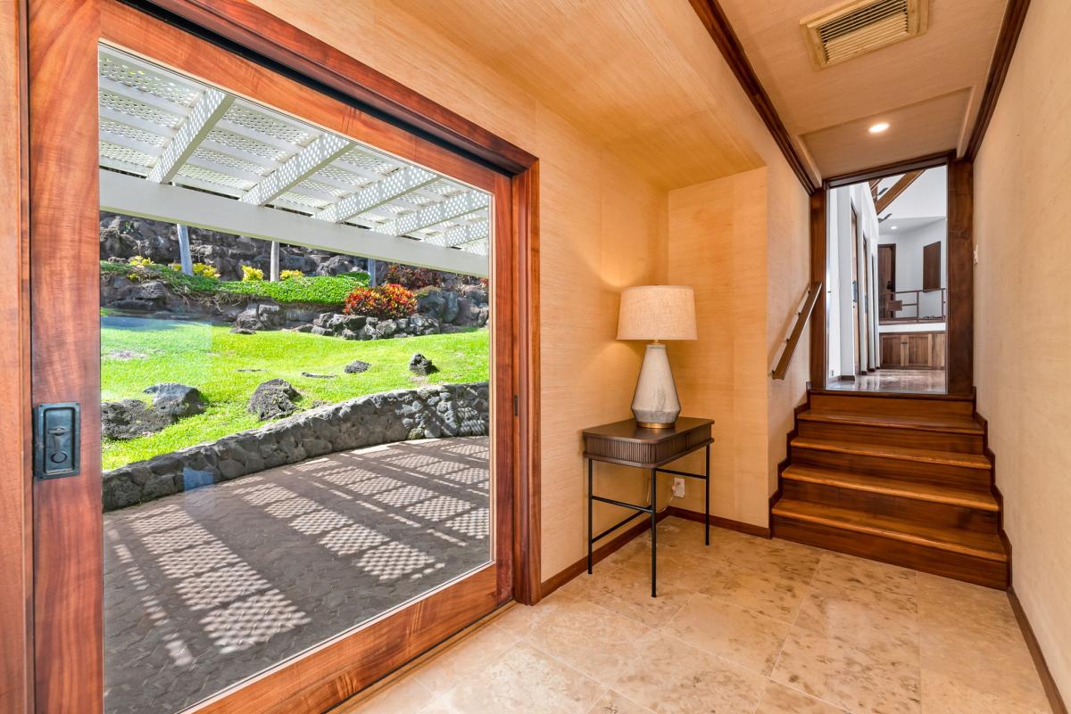 Your private garden-view entrance welcomes you with warm wood tones and thoughtful touches, creating an instant sense of home.