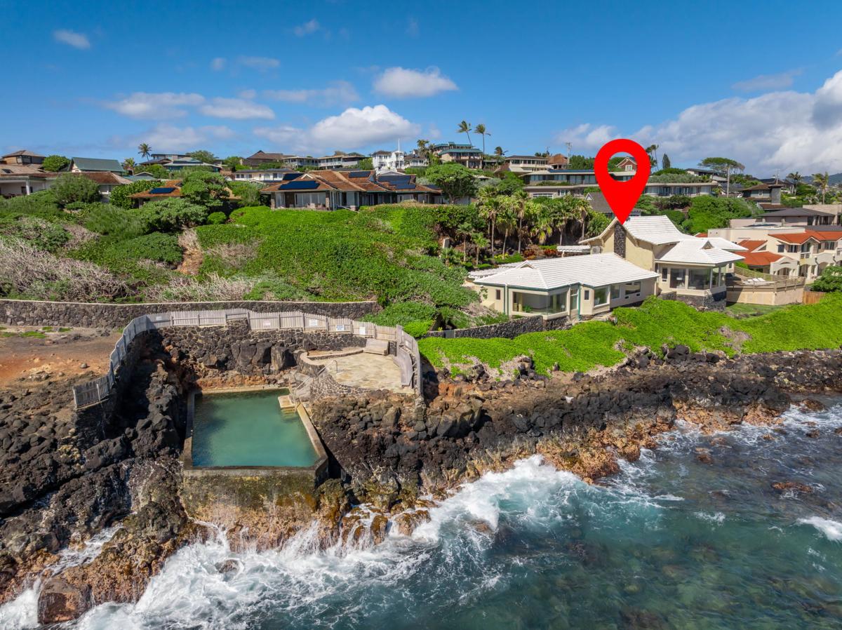 Oceanfront location with natural lava rock pool and scenic coastal community views on this tropical island setting.