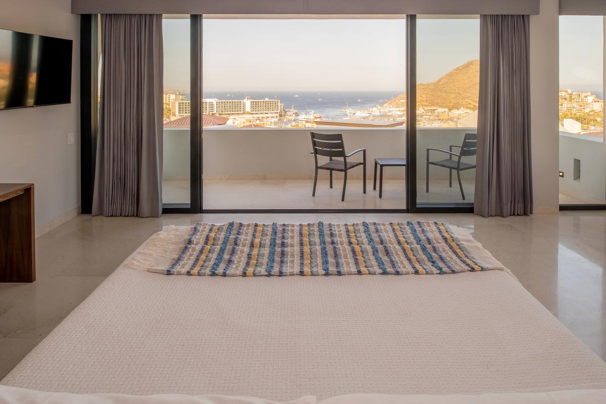 Bedroom suite with terrace access and views