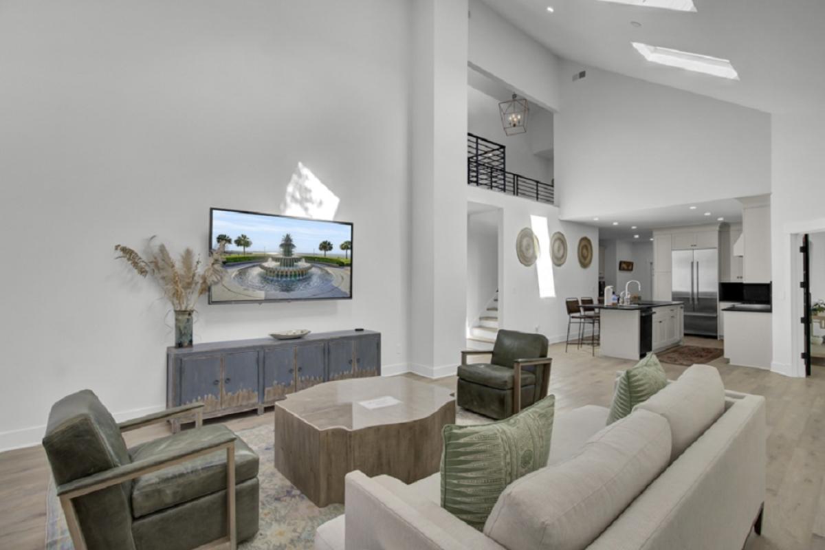 - Stream your favorite shows on the wall mounted TV beneath soaring ceilings - Statement furniture and curated décor blend modern style with cozy warmth - Open sightlines extend to the chef’s kitchen and upstairs loft