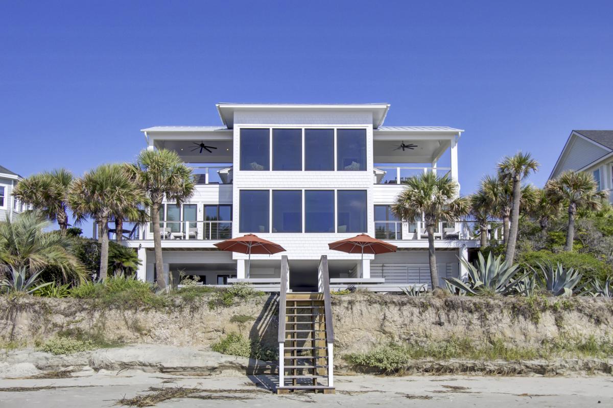 Stunning beachfront villa with panoramic windows, wraparound terraces, and direct beach access.