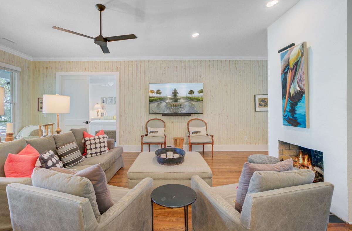 Unwind in your elegant living room with cozy seating, warm fireplace, and stylish decor creating the perfect retreat.