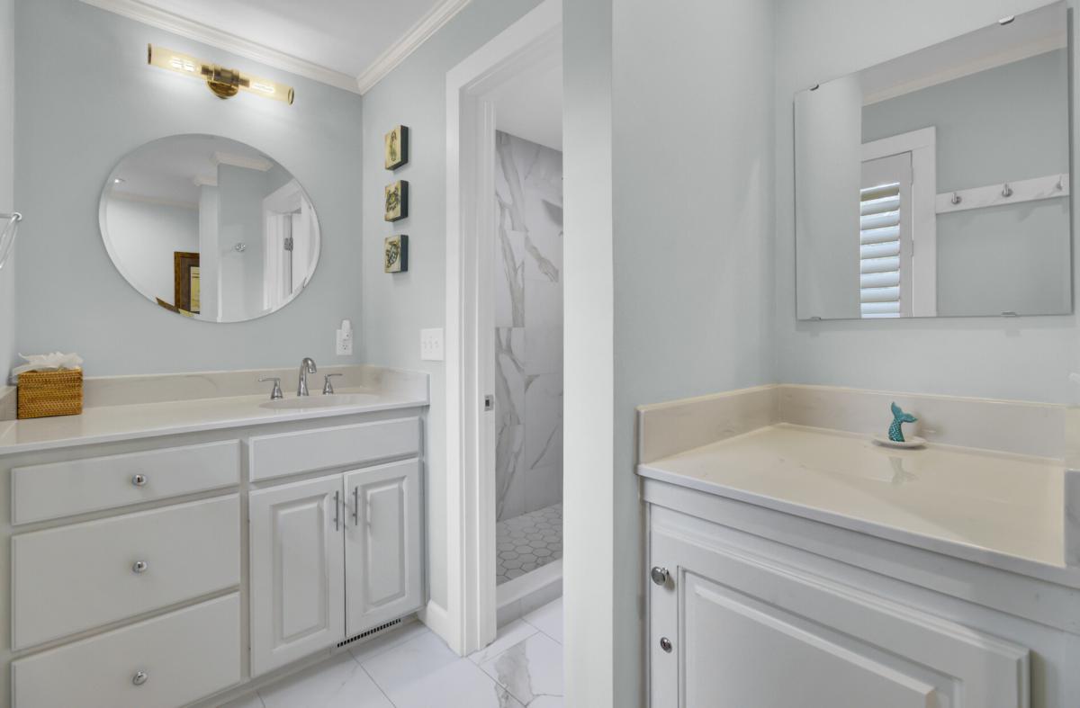 Indulge in your luxurious bathroom sanctuary featuring marble shower, soaking tub, and elegant vanities for ultimate relaxation.