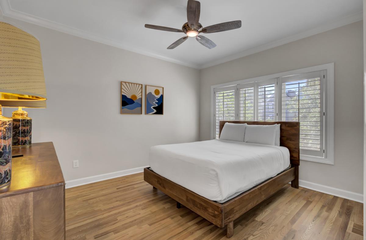 Drift off in your peaceful bedroom sanctuary with crisp linens and modern touches that create the perfect retreat.