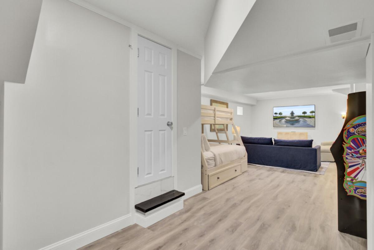 Your basement bedroom features a cozy bunk bed and sleeper sofa, perfect for families or groups seeking flexible sleeping arrangements.