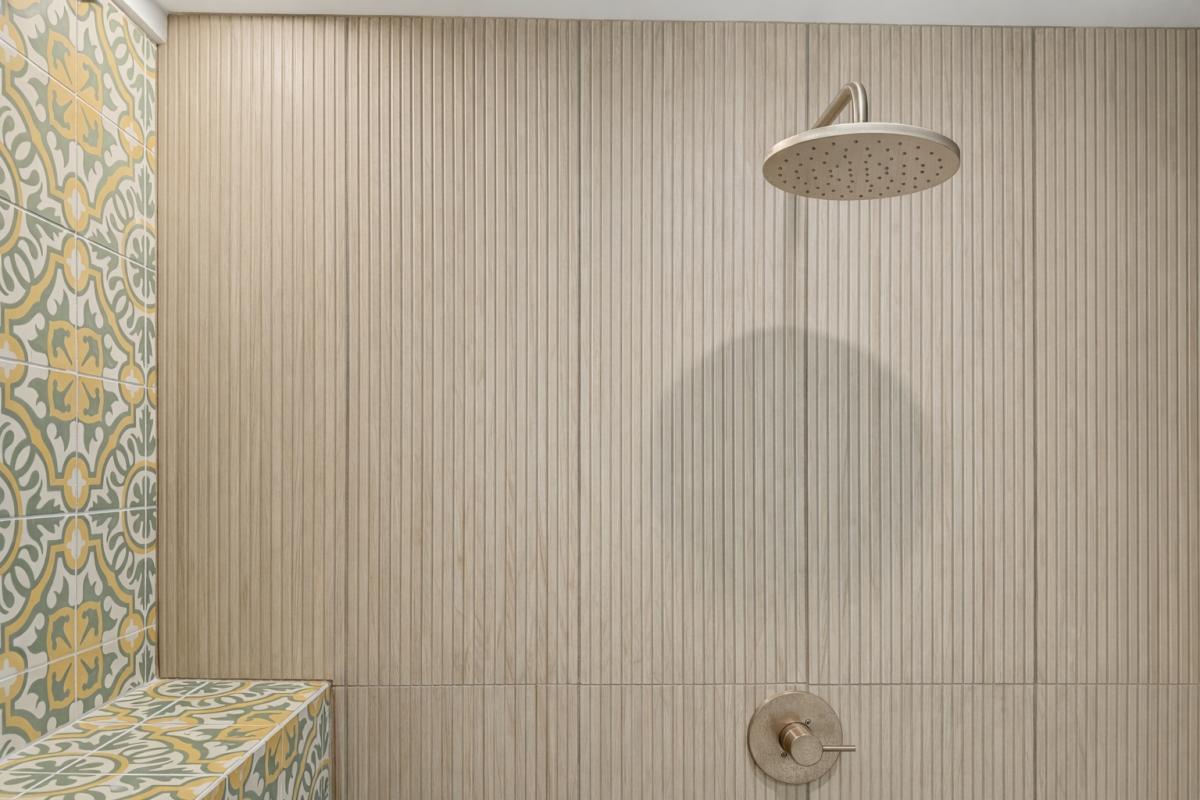 Rinse the day off in your spa-like shower with beautiful patterned tile accents and sleek modern fixtures.