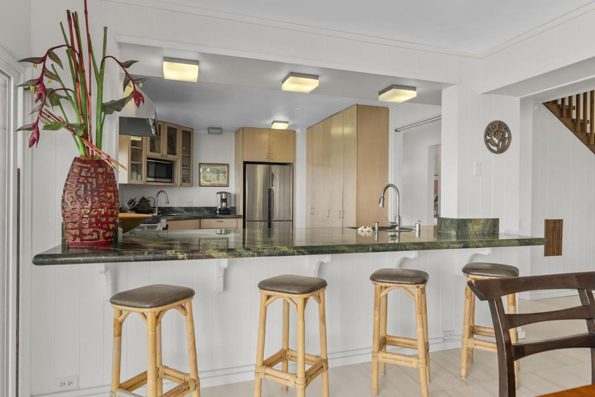 Gather around this spacious granite-topped kitchen island where you'll love preparing meals and sharing stories over morning coffee.