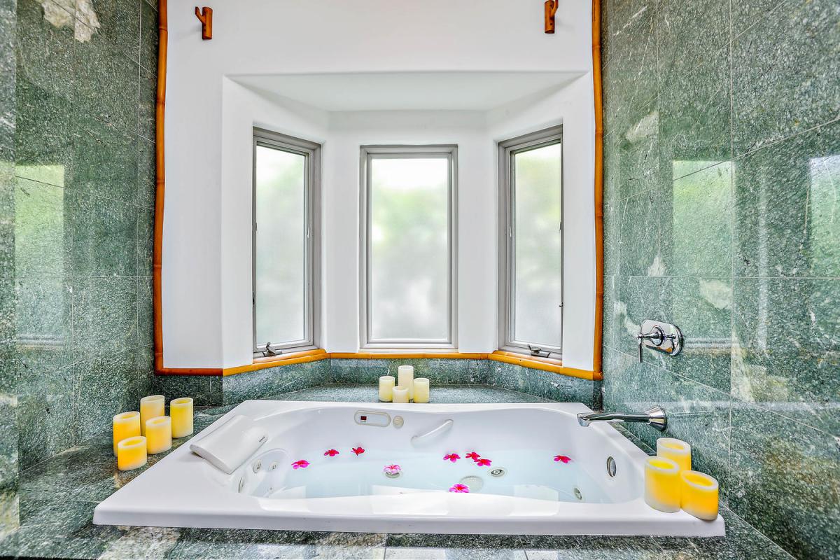 Spa Like Master Bathroom with jetted tub, shower, dual sinks.
