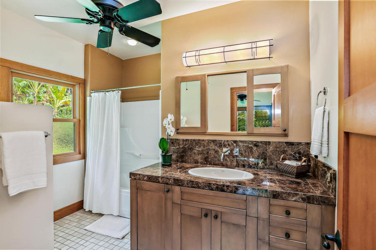 Second Master Bedroom ensuite bathroom with shower/tub combo.