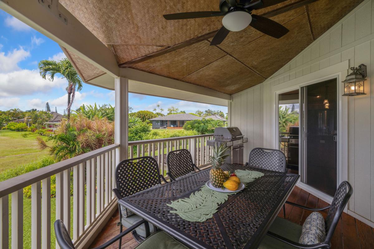 The upstairs lanai has sweeping views of the mountains and golf