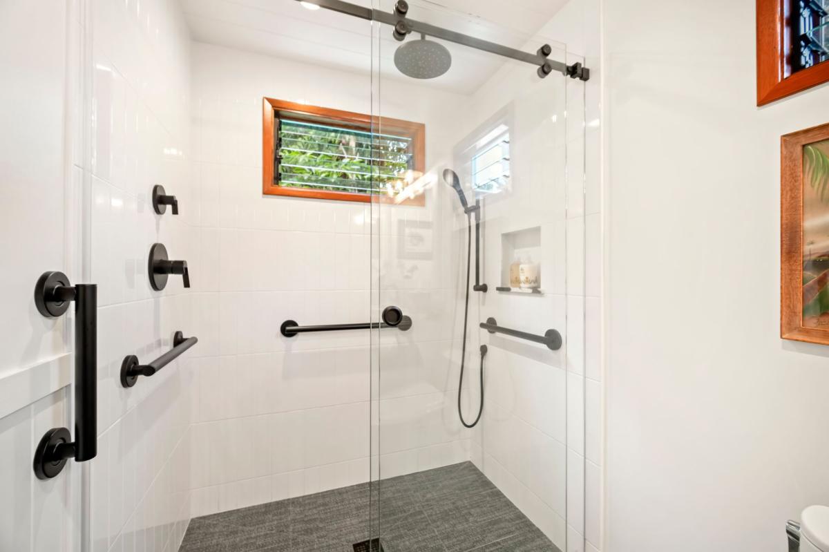 Stand up shower with support rails
