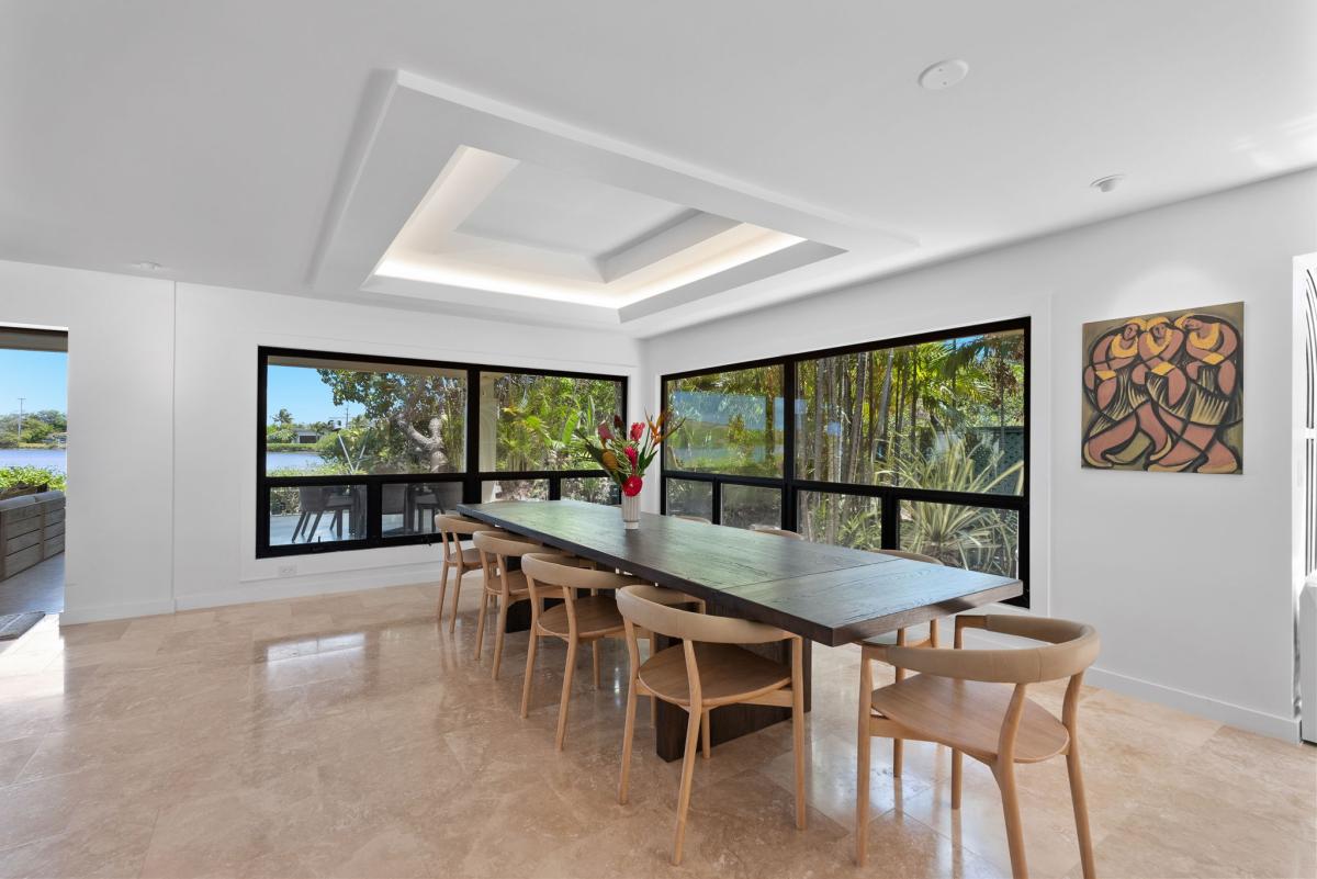 Dining space wrapped in greenery and natural light, designed for shared moments.