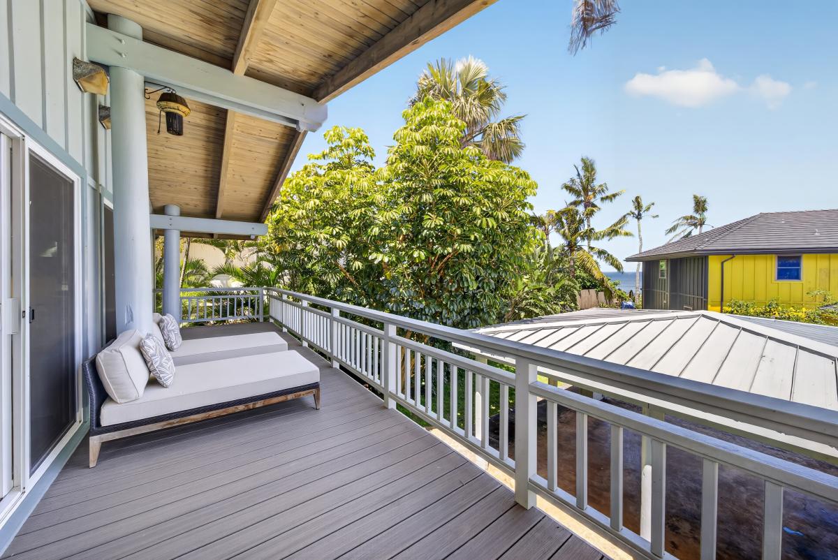 Lounge on your covered lanai and unwind with peaceful garden and partial ocean views.