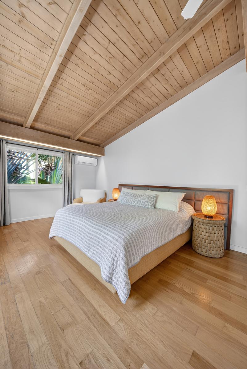 Enjoy a calm retreat with natural light, wood accents, and plenty of open space.