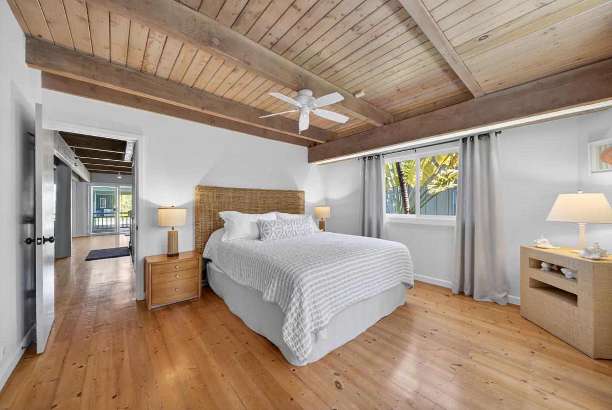 Recharge in the airy bedroom with Cal king bed, high ceilings and relaxed coastal-inspired touches.