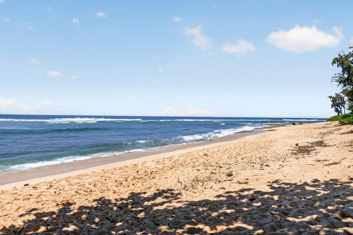 Spend peaceful days along the wide sandy beach just moments from the home.