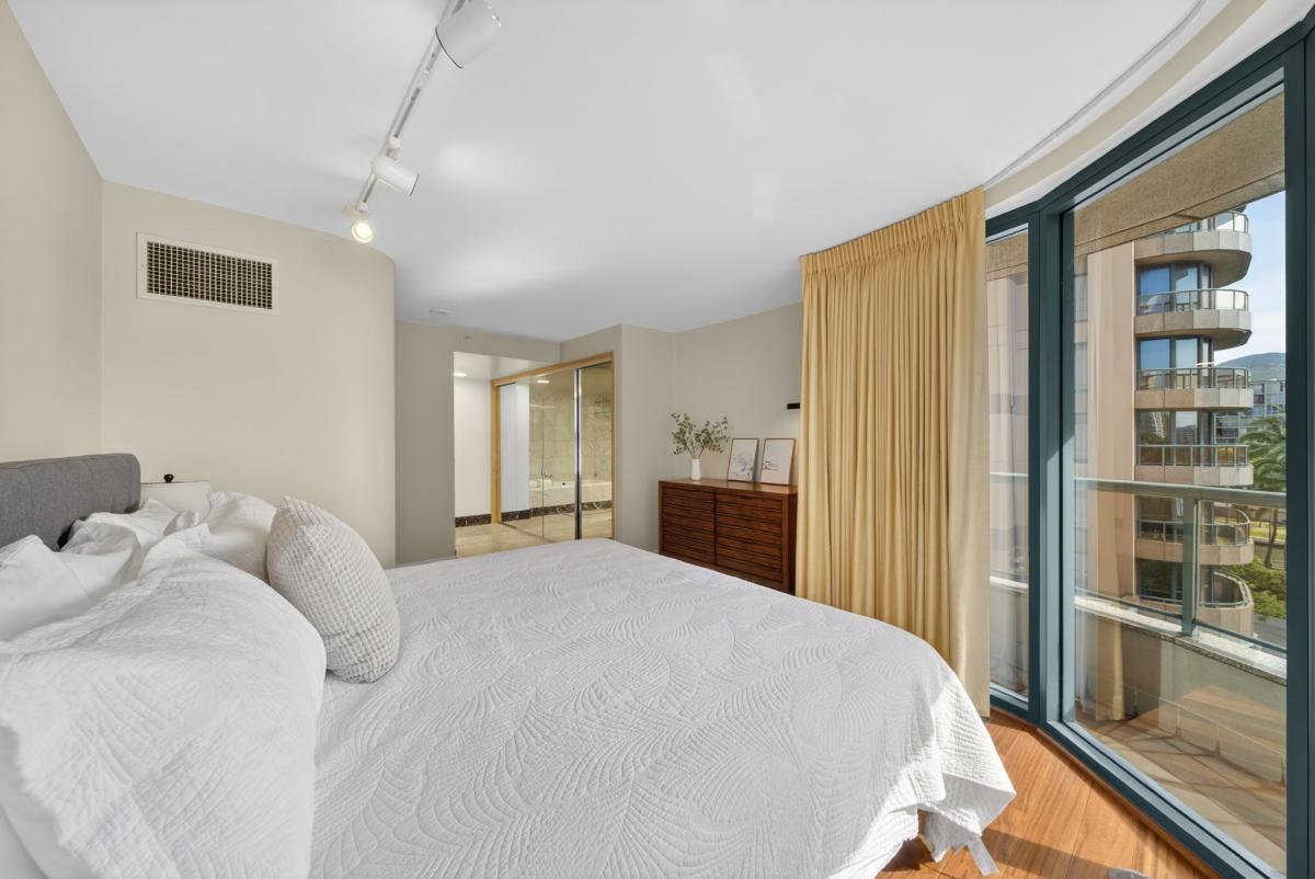 Breathe easy in this airy bedroom with lanai access and soft morning light throughout.