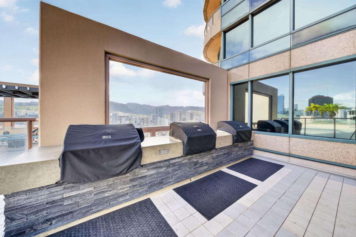 Fire up dinner at the rooftop grilling area with mountain and skyline views nearby.