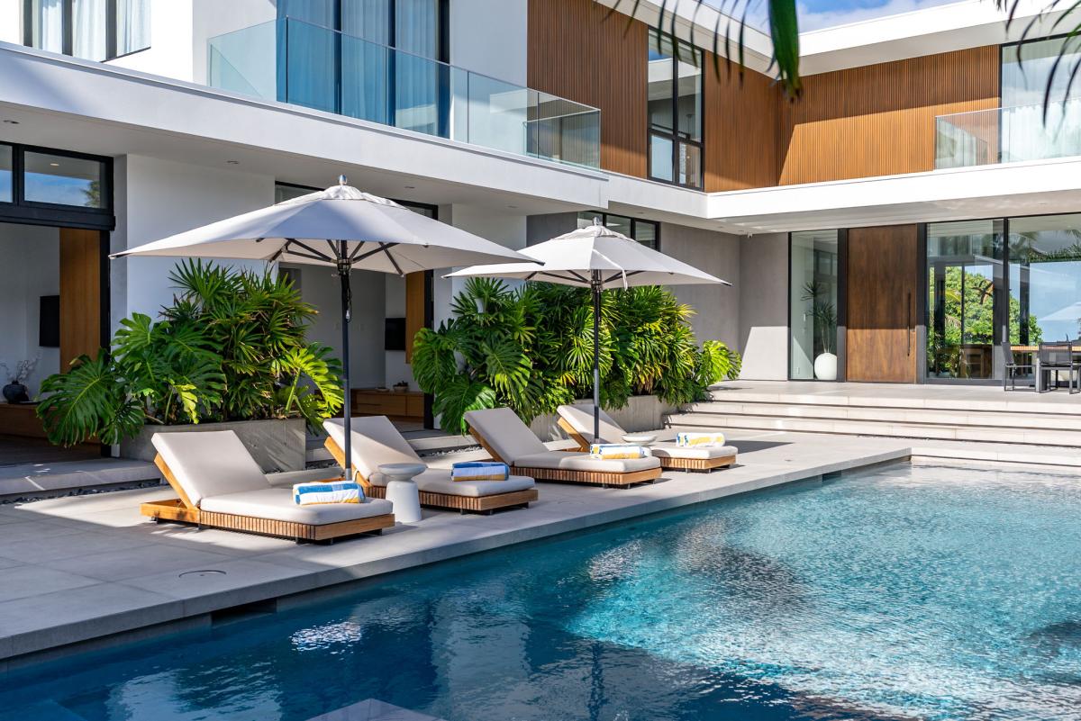 Stretch out on a lounger and settle into the home's relaxed indoor-outdoor lifestyle.