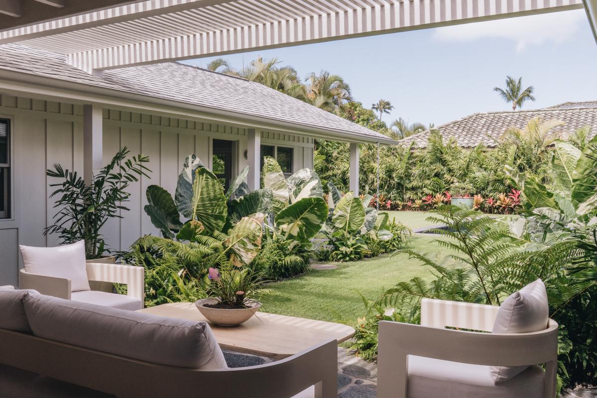 Surrounded by tropical greenery, this peaceful outdoor setting invites you to slow down and unwind.