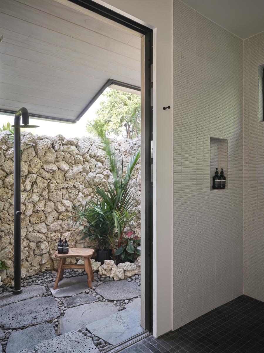 Refresh after a swim or simply enjoy one of island living's simple pleasures in this private outdoor shower surrounded by tropical landscaping.