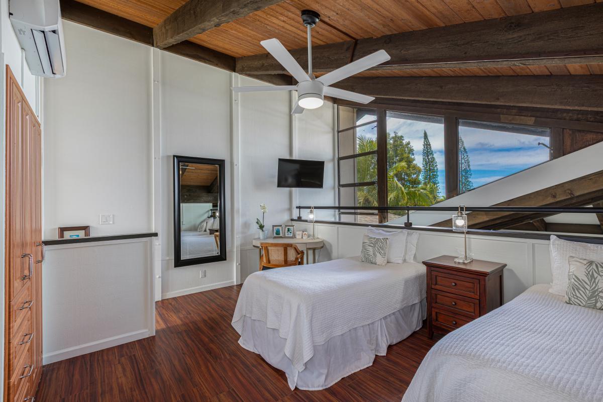 Versatile twin bedroom features twin-bed setup easily converts into a king—ideal for kids, friends, or couples.