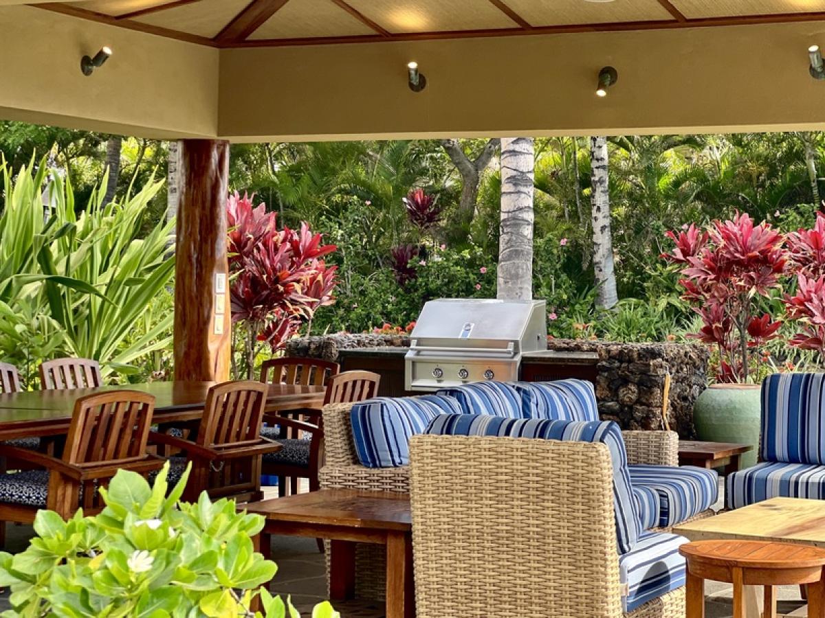 The Ocean Club Amenity Center offers a BBQ Grill and ample seating to gather, dine and relax