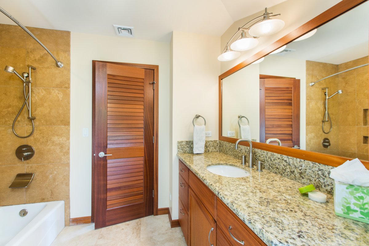 Granite counters and a walk-in shower give Suite 2's ensuite a polished finish.