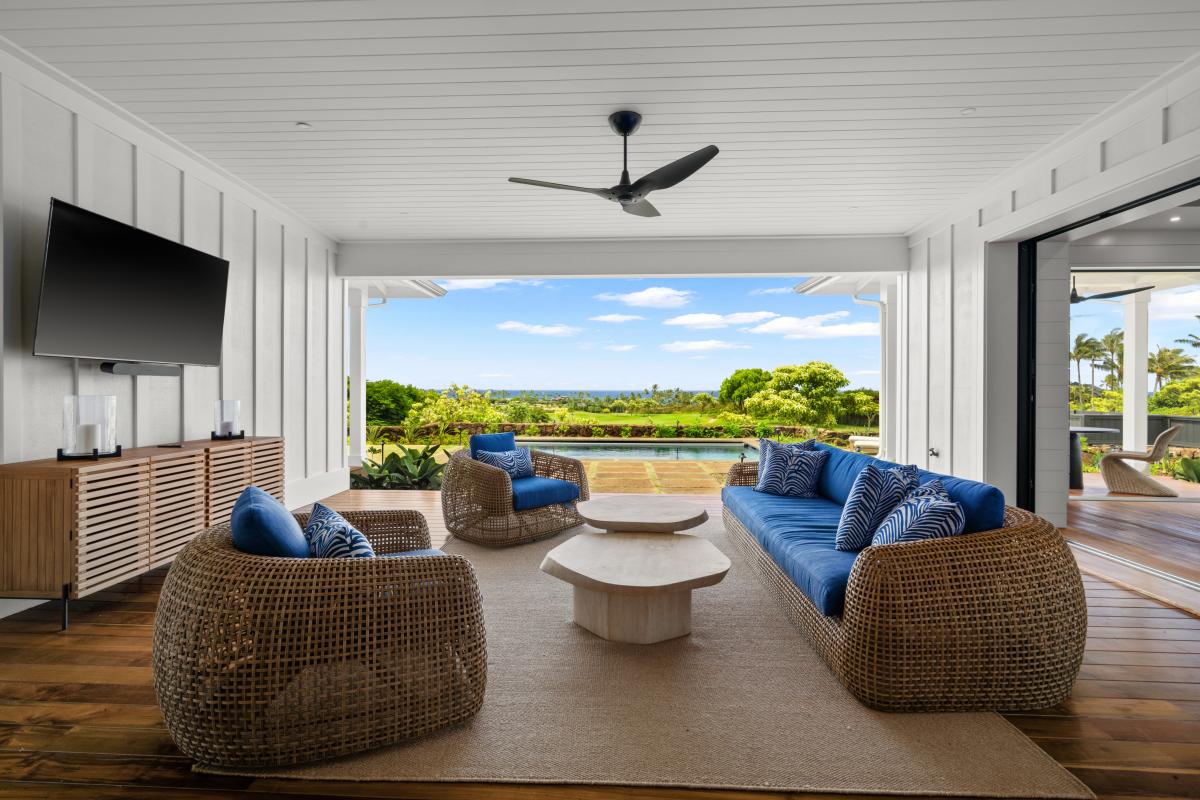 The lanai opens straight to your private pool and distant ocean views.
