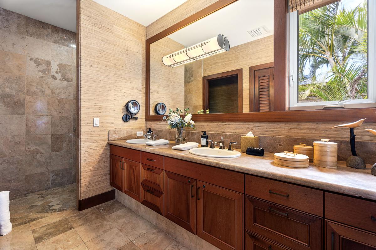 Granite and a double vanity, so the second suite never feels like the runner-up.