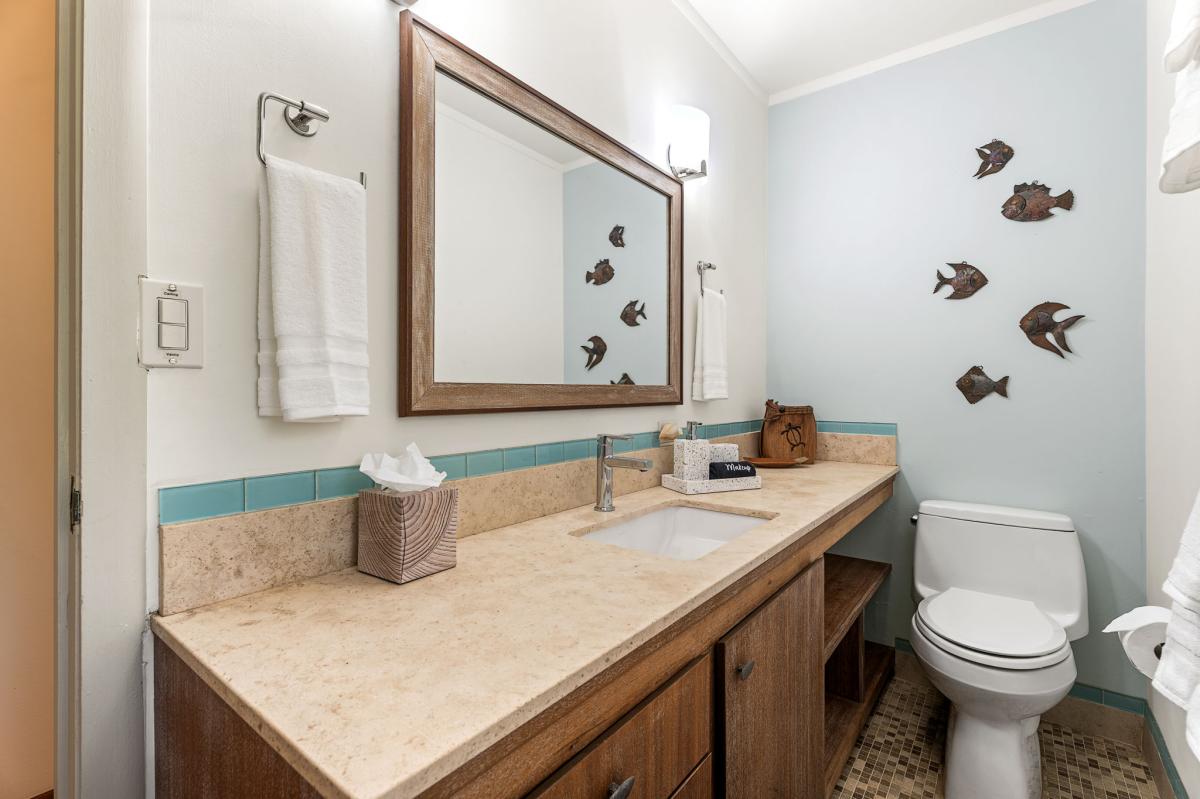A large mirror and spacious vanity area make it easy to get ready for the day.