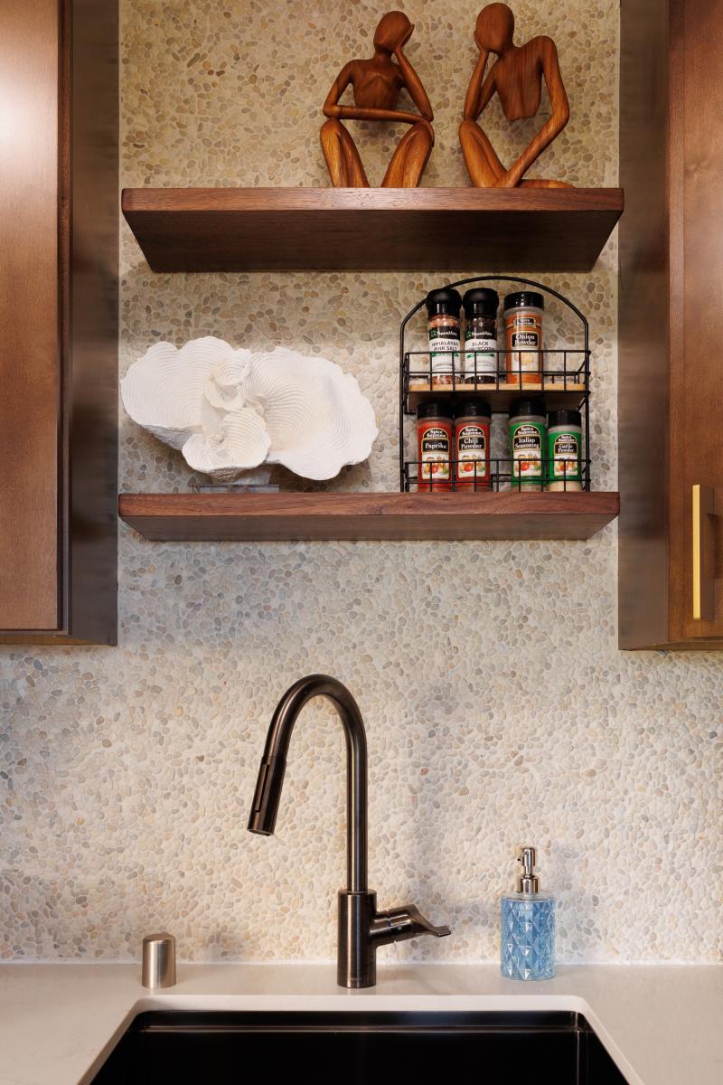 Brass fixtures and open shelving, small details you notice on day one.