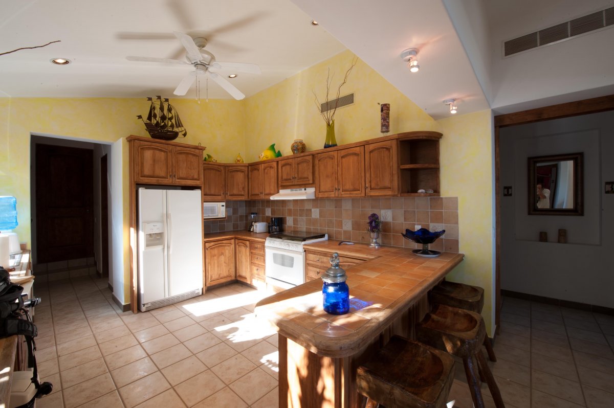 Sunlit kitchen with bar stools